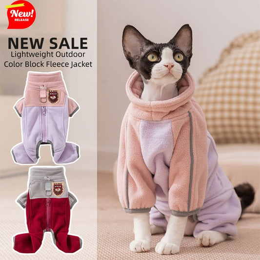 Small cat wearing a pink warm four-leg fleece pet jacket