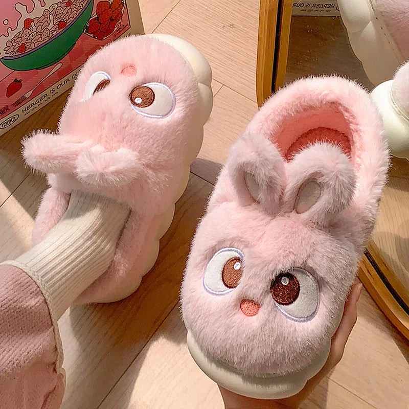 Women wearing cute pink rabbit plush slippers with bunny design