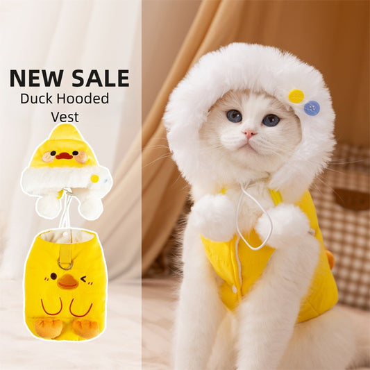 White cat wearing a cute yellow duck fleece pet outfit